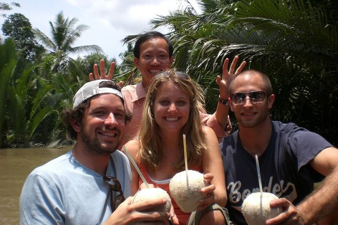 1-day My Tho boat trip in Mekong Delta group tour from Ho Chi Minh - An Khanh by hand-rowed sampan: coconut trees, canals, and folk songs