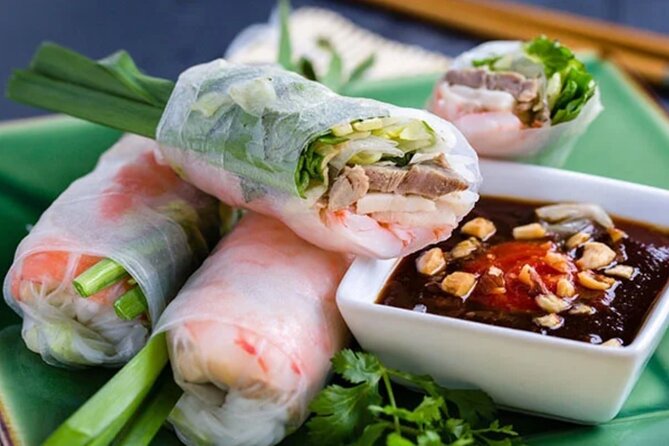 12 Tasting Street Food & Sightseeing By Scooter with Student - Stop 3: Ho Thị Kỷ Flower Market and Street Snacks Between the Blooms