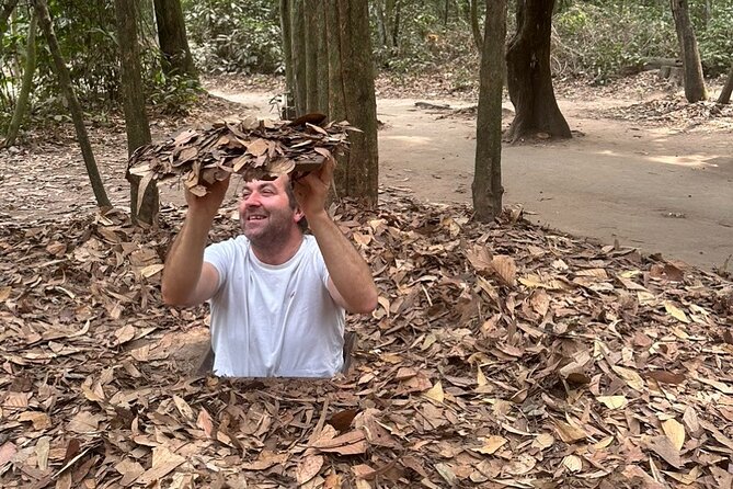 Cu Chi Tunnels and Mekong Delta 1 Day Tour from Ho Chi Minh City - Entering Cu Chi: tunnels, traps, workshops, and the B52 bomb hole