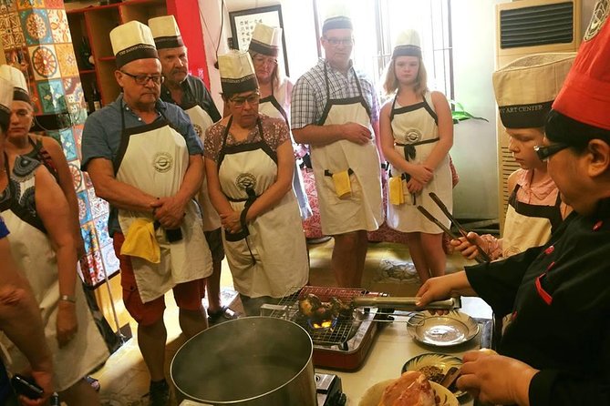 Experience half-day cooking class with market visit - Logistics in District 1: meeting point, group size, and timing