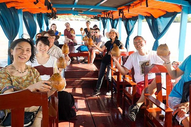 From HCM City: Mekong Delta Tour with Sampan Journey - Unicorn Islet: village life, fruit tastings, honey tea, and folk music