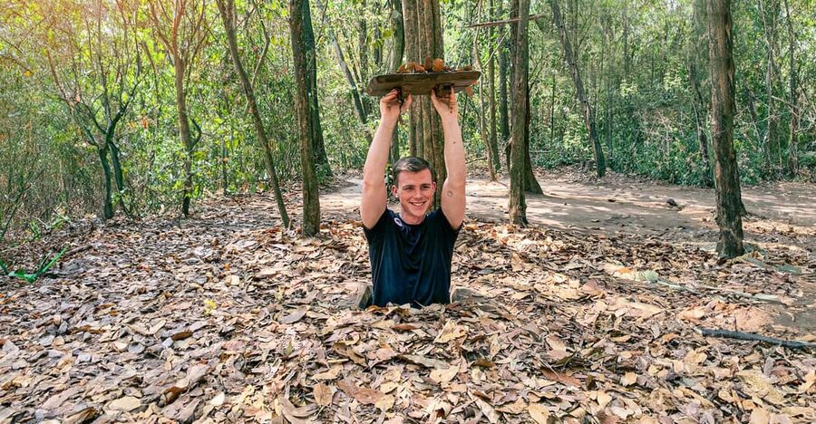 From HCM: Cost-Saving CuChi Tunnel & Mekong Delta 1-Day Tour - Cu Chi Tunnels: documentary, traps, and a 100-meter crawl
