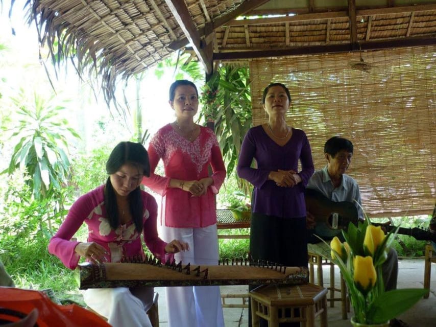 From Ho Chi Minh: Delta Full-Day Tour - Rowing boat into a small canal: coconut trees and quiet garden views