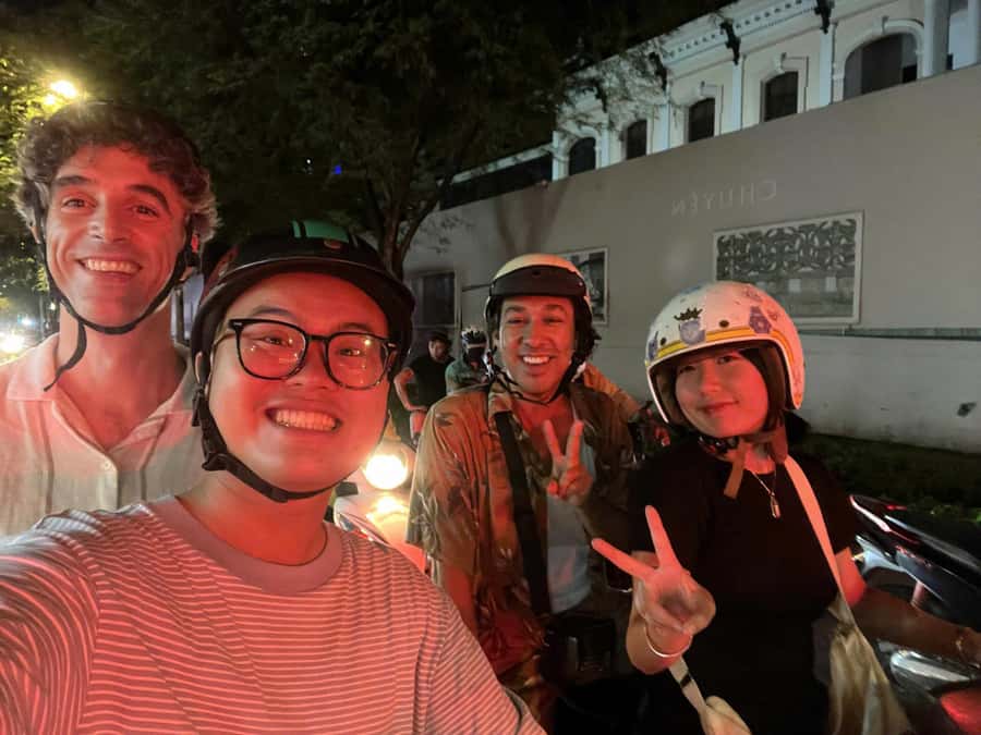 Ho Chi Minh: Local Food Tour by Scooter with Vegan Option - Safety first: helmets, ponchos, and calm drivers in chaos