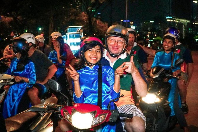 Ho Chi Minh Night Tour by Motorbikes with Female Rider | KissTour - Safety and comfort on a scooter in Saigon traffic