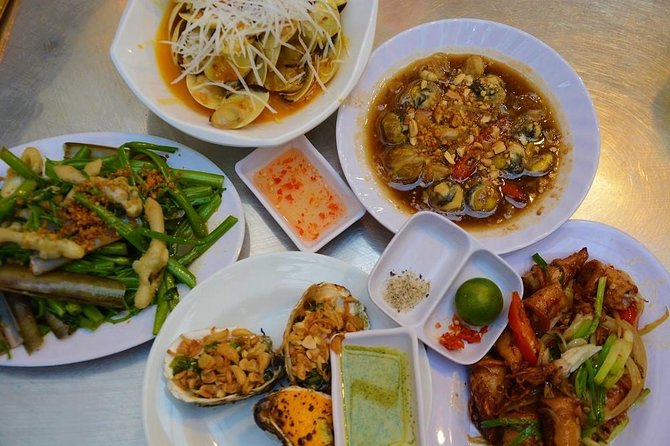 Ho Chi Minh Nightlife & Street Food Tour By Motorbike - Bitexco Financial Tower at night: your first skyline cue
