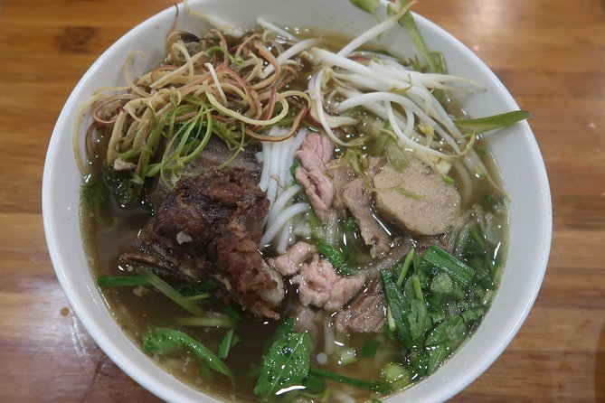 Ho Chi Minh Private Half Day Street Food Tour with Local Students - BBQ pork with rice noodles and the “on the way” snack strategy