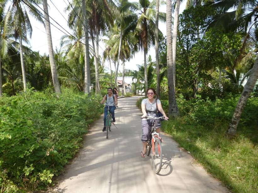Mekong Day Tour by Car:Cai Be market, Local Island & Cycling - Sampan ride through narrow canals: where the Delta feels close