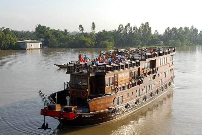 Mekong Eyes Cruises 2Days/1 Night - Day 2 Starts with Morning Tea, Then Cai Be Floating Market by Long Sampan