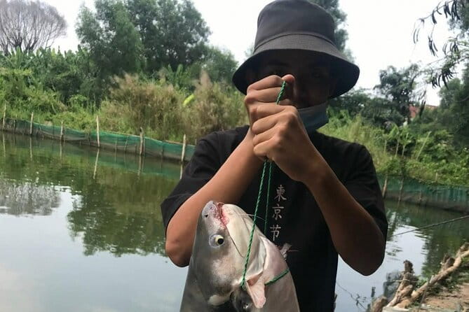 Private Full-Day Ho Chi Minh City Fishing Adventure - Binh Quoi Village: fishing setup, lunch break, and a bigger lake in the afternoon