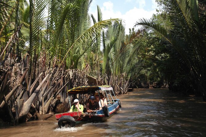 Private Mekong Delta Less Tourist - Coconut Island Tour - Vinh Trang Temple: a cultural reset near the end
