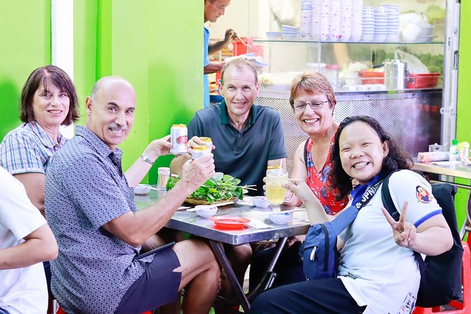 Private Street Food Evening Walking Tour in Ho Chi Minh City - Walking through real Saigon: districts, streets, and vendor culture