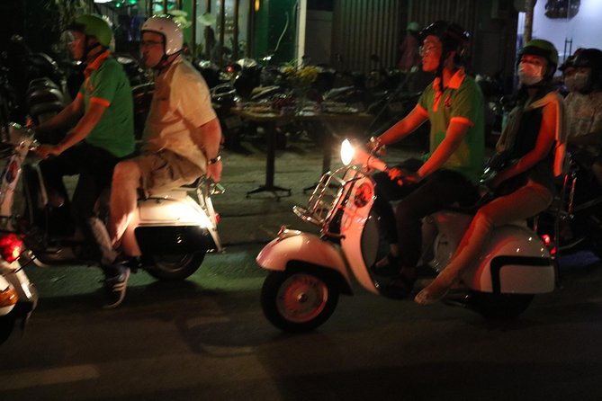 Saigon After Dark Vespa Street Food Tour + Live Music 4 hours - Stop 3: banana cake and the story of street food