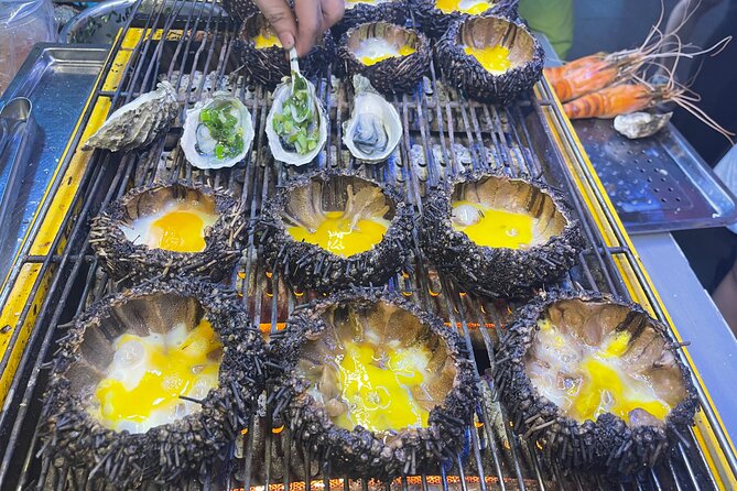 Saigon By Night and Street Food By Motorbike | Opt: Ao Dai Riders - Food You’ll Actually Want to Talk About Afterward