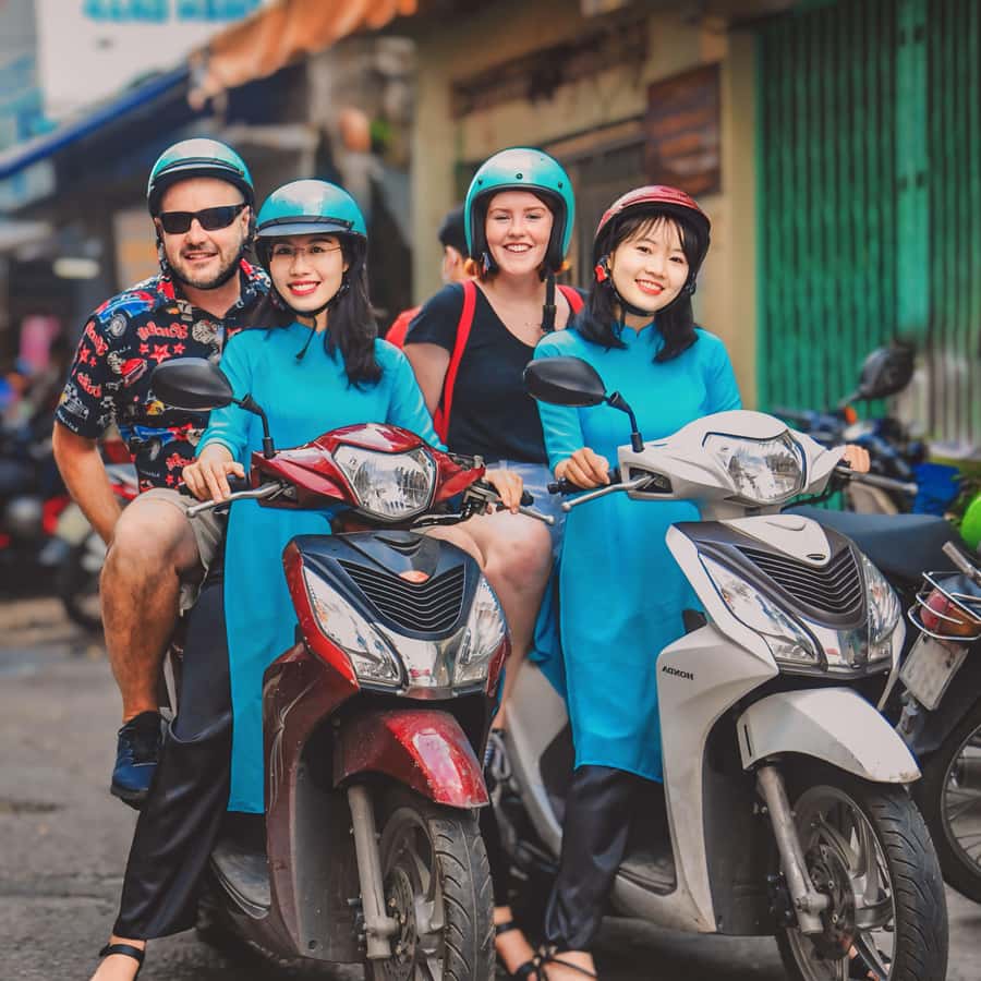 Saigon: Michelin Guide Food Tour with Ao Dai Female Riders - How the scooter ride is managed so you can relax