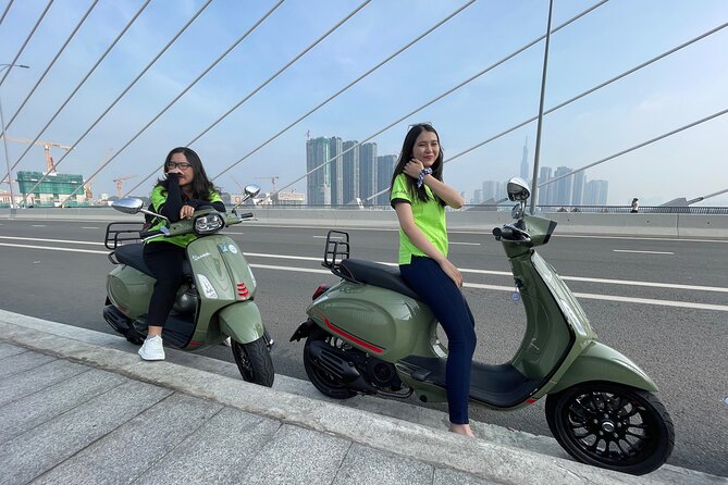 Saigon Morning and Afternoon Adventure by Vespa - Bridge contrasts: modern District 5 vs riverside stilt houses