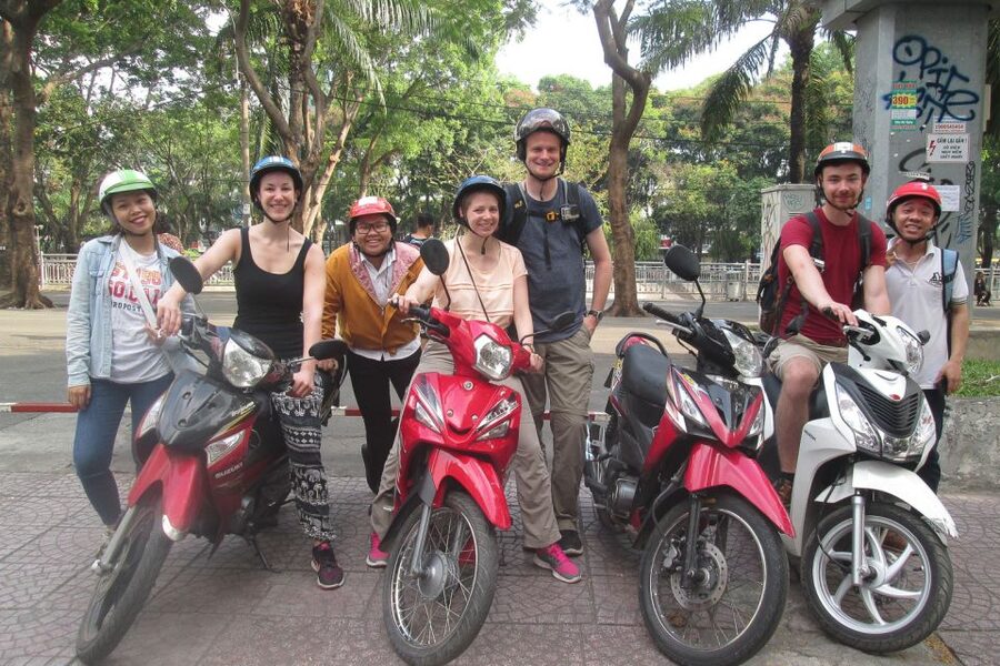 Saigon Slum Tour with Motorbike - The food stop that makes it real: 2,000 VND rice at a charity stall