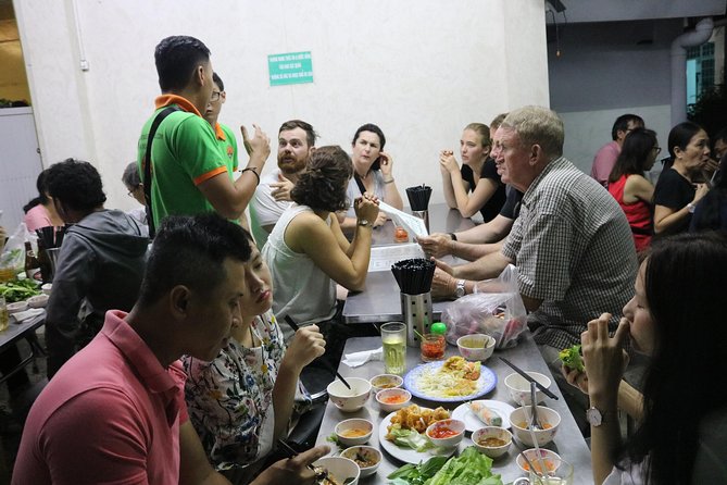 Saigon Vespa By Night Street Food Tour 4,5 Hours - Food stops that feel local, not staged