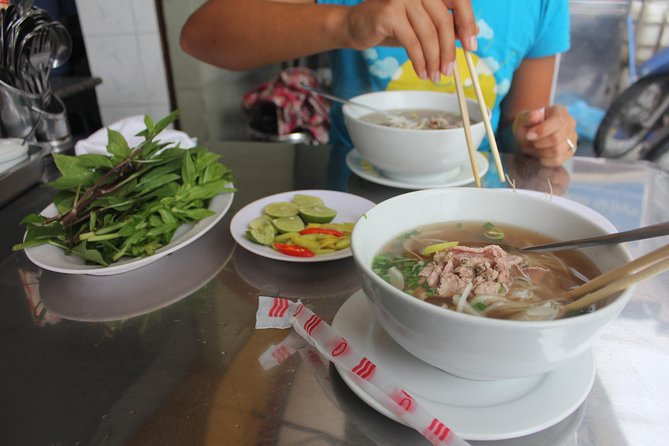 Small-group Street Food Lover by Motorbike (04 hours) - Ho Thi Ky Flower Market: The 90-Minute Taste-and-Demo Stop