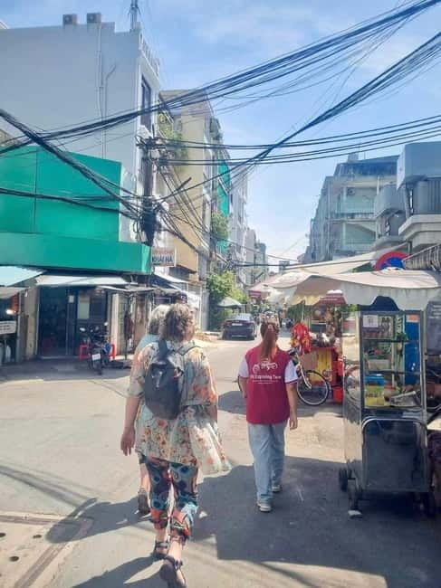 Top Saigon Unique Street Food On Scooter w/ Locals - How the night moves: food stops plus market and temple-area moments